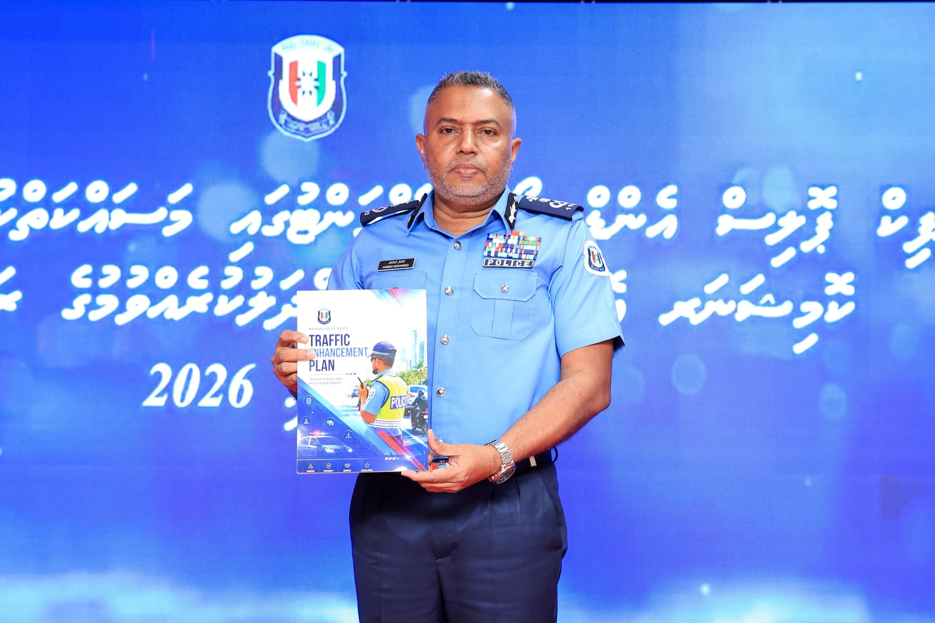 Commissioner of Police Ahmed Mohamed holds the Traffic Enhancement Plan booklet during the official launch ceremony at Iskandharu Koshi 1. | Photo: Maldives Police Service 